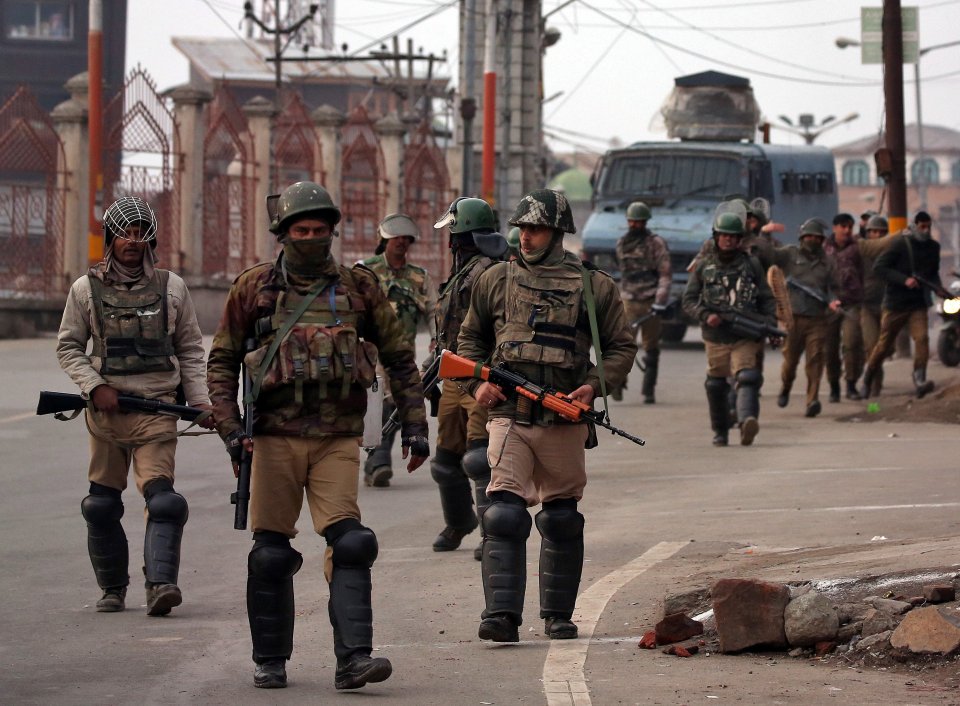  Indian Central Reserve Police Force (CRPF) soldiers patrol a street in downtown Srinagar last week