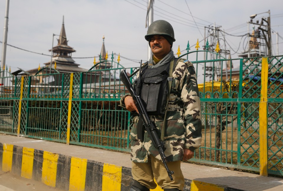  An Indian paramilitary soldier stands guard in Srinagar, Indian Kashmir last week amdi rising tensions with Pakistan