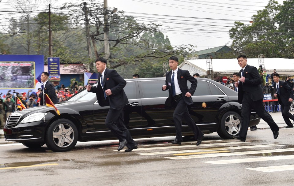 Kim Jong-un’s battalion of bodyguards keep pace with the leader’s limo