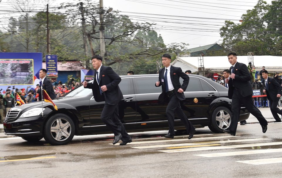  Kim Jong-un's battalion of bodyguards keep pace with the leader's limo