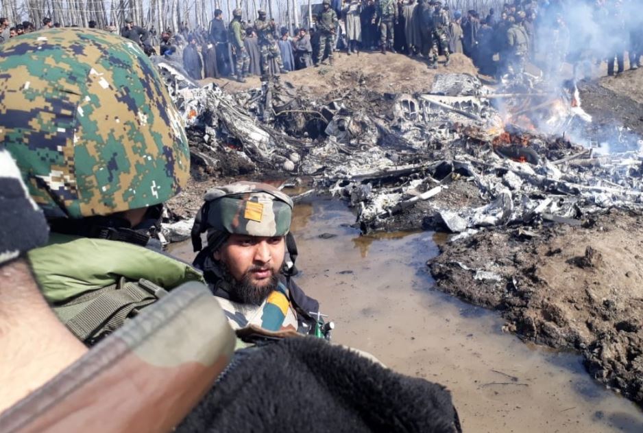 Crowds gathered around the crash site in Kashmir