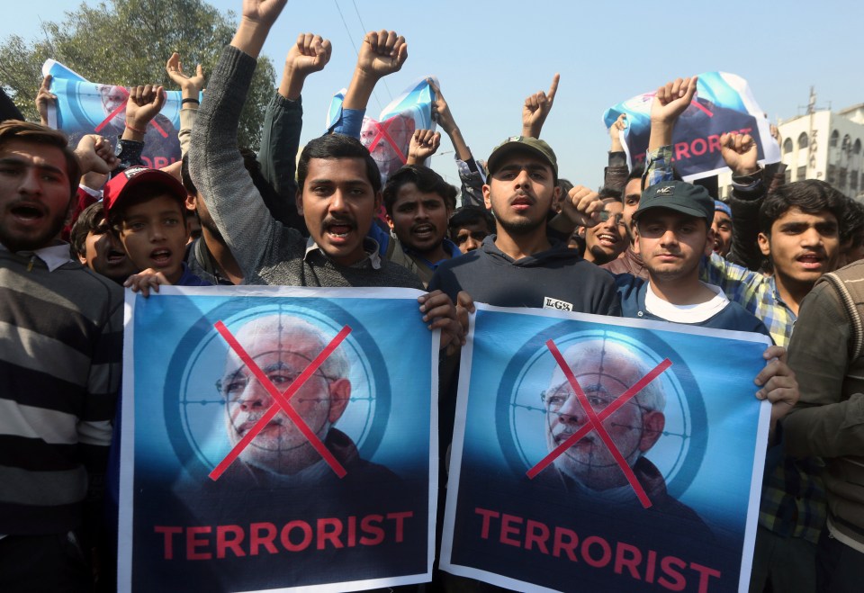 Supporters of a Pakistani religious group Islami Jamiat-e-Talaba hold a rally against India today