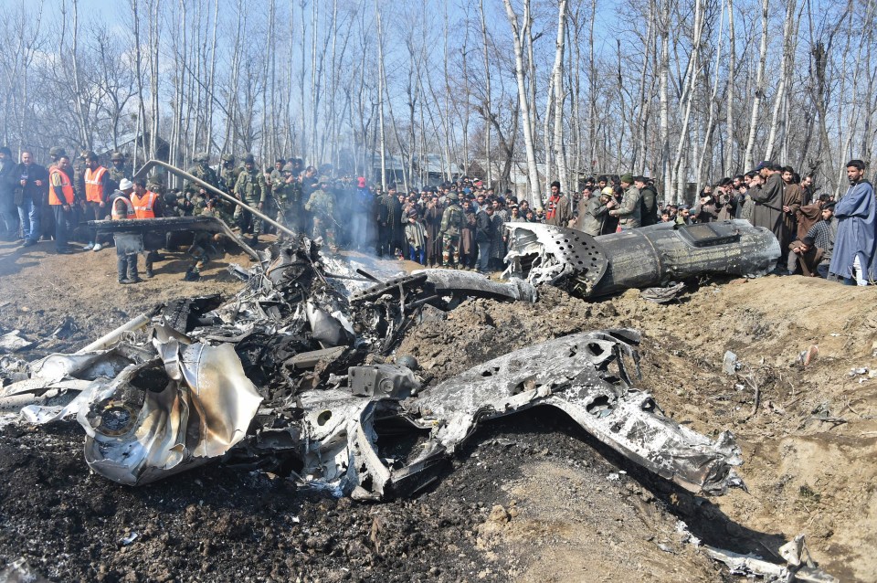 Pieces of twisted metal are seen on the ground