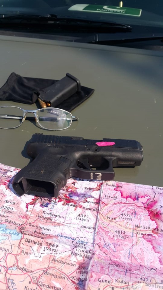 Another photo released by Pakistan authorities showed a confiscated gun, map and glasses