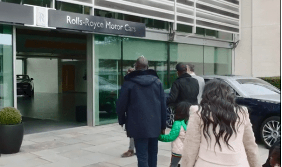 Crystal Palace defender Sakho enters the Rolls Royce dealership with his family