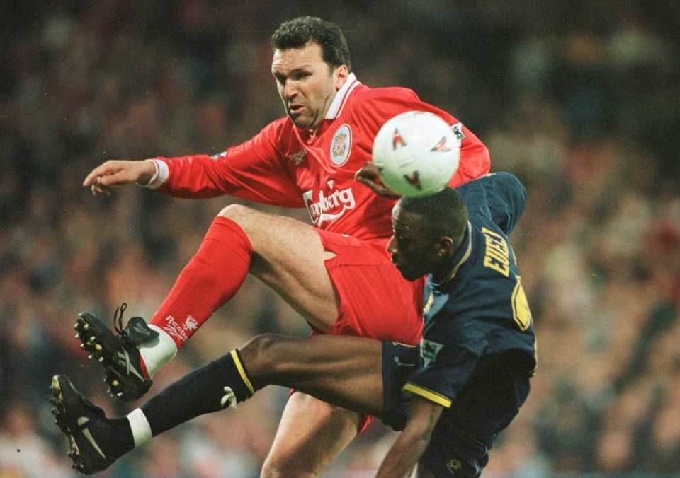  Neil Ruddock challenges goal scorer Jason Eueli during a match in May 1997