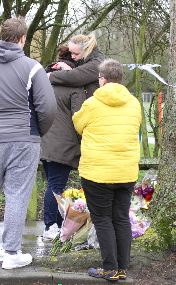  Claire is embraced by loved ones at the scene of her daughter's killing