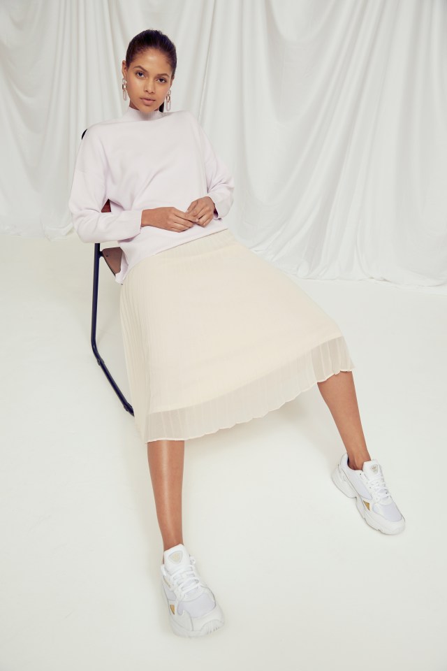  Keep your outfit modern by teaming a girly pleated skirt with a relaxed slouchy jumper