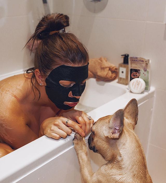  Olivia Buckland showed off her pampering routine as she was snapped wearing a face mask while taking a wash – joined by one of her French bulldog