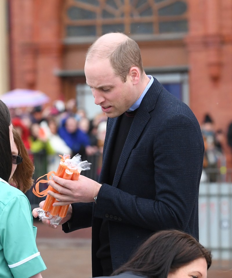 Prince William receives a gift from one fan