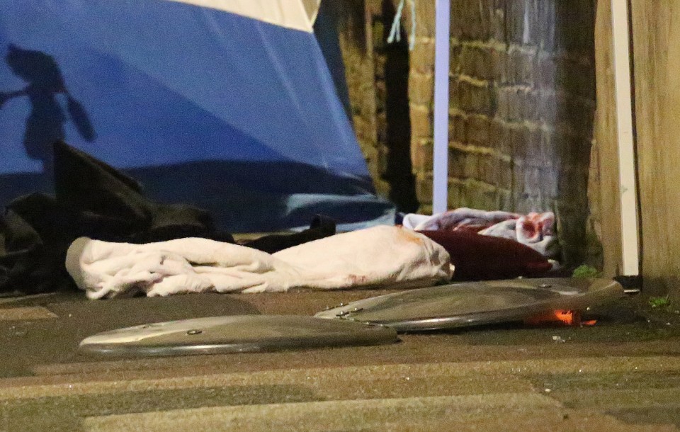  The man's bloodied clothes could be seen at the scene last night