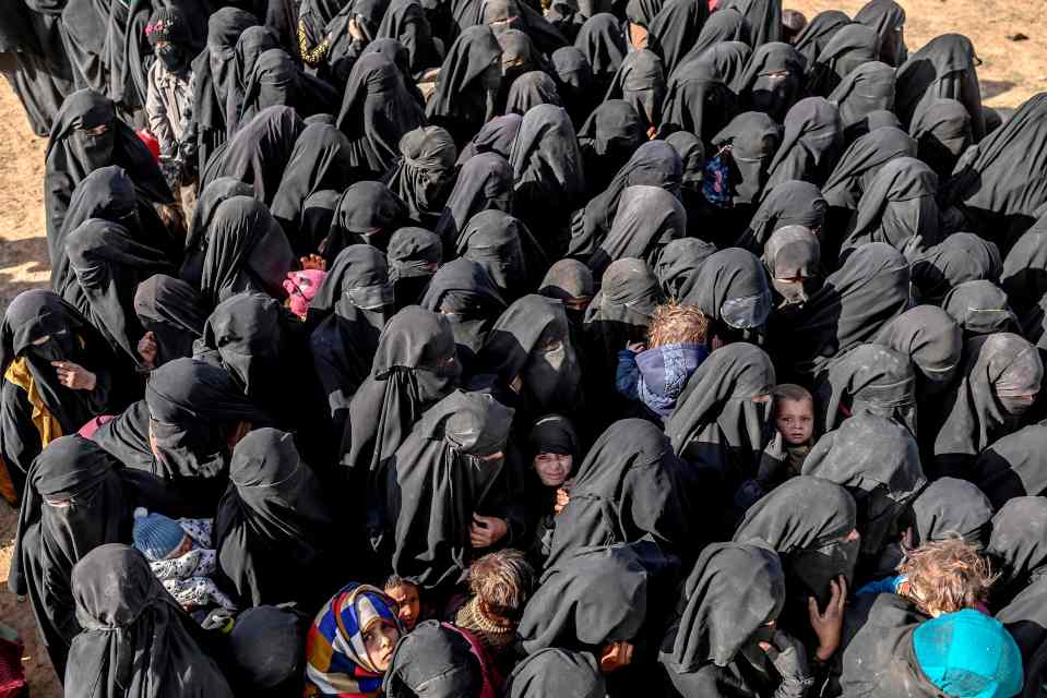  Civilians evacuated from the Islamic State (IS) group's embattled holdout of Baghouz wait for bread and water at a screening area