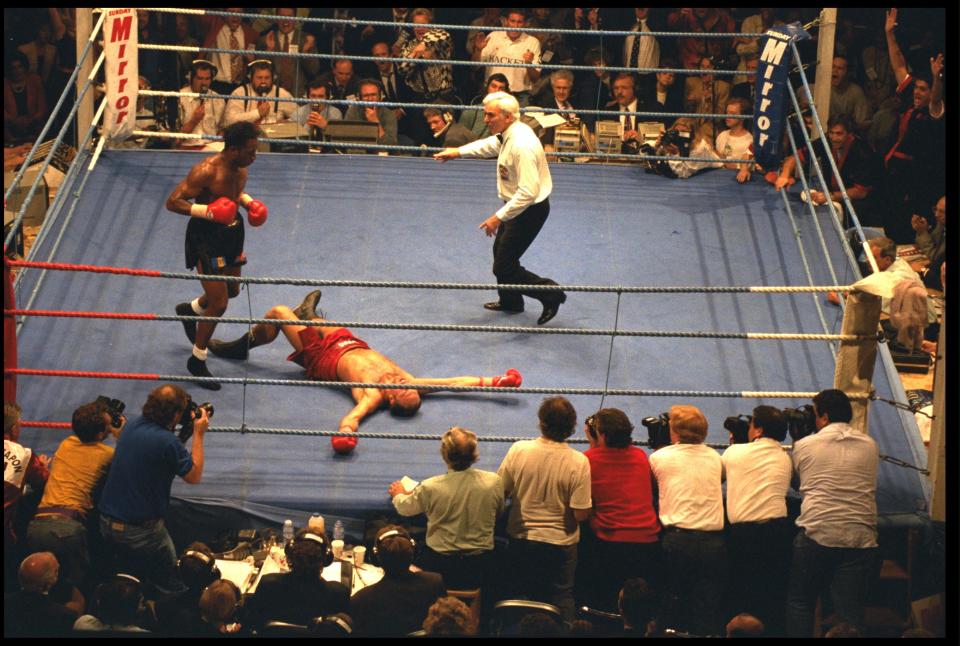  Nigel Benn looks down at Louis Gent in a 1993 world title fight