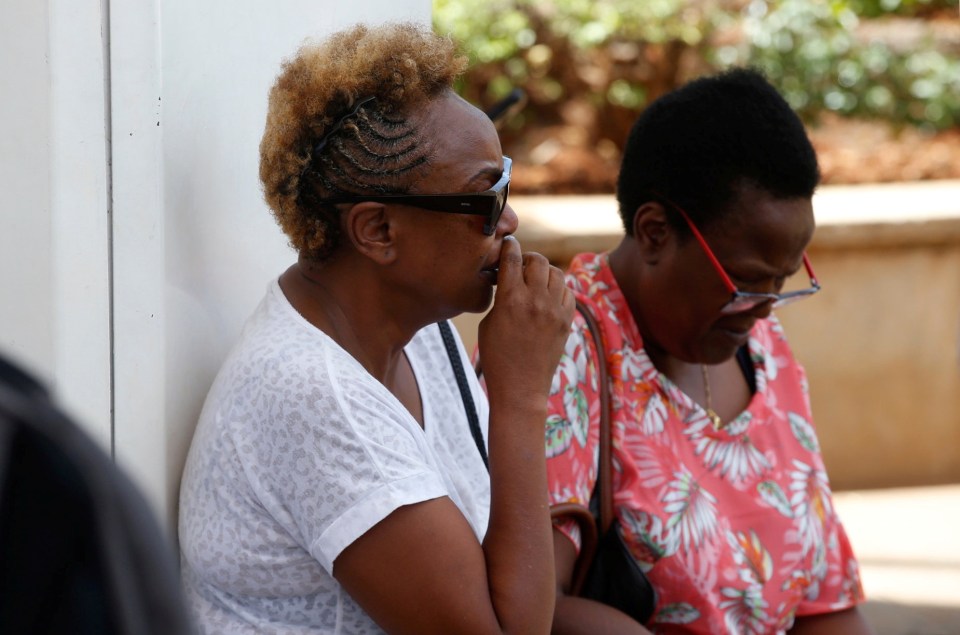 A tearful woman waiting at the Jomo Kenyatta International Airport in Nairobi for news of her fiance, who was onboard the fatal flight