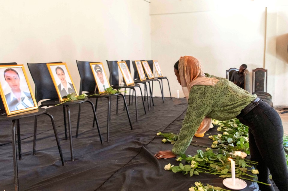 A member of the Ethiopian Airline Pilots' Association mourns as she attends a memorial service for the victims