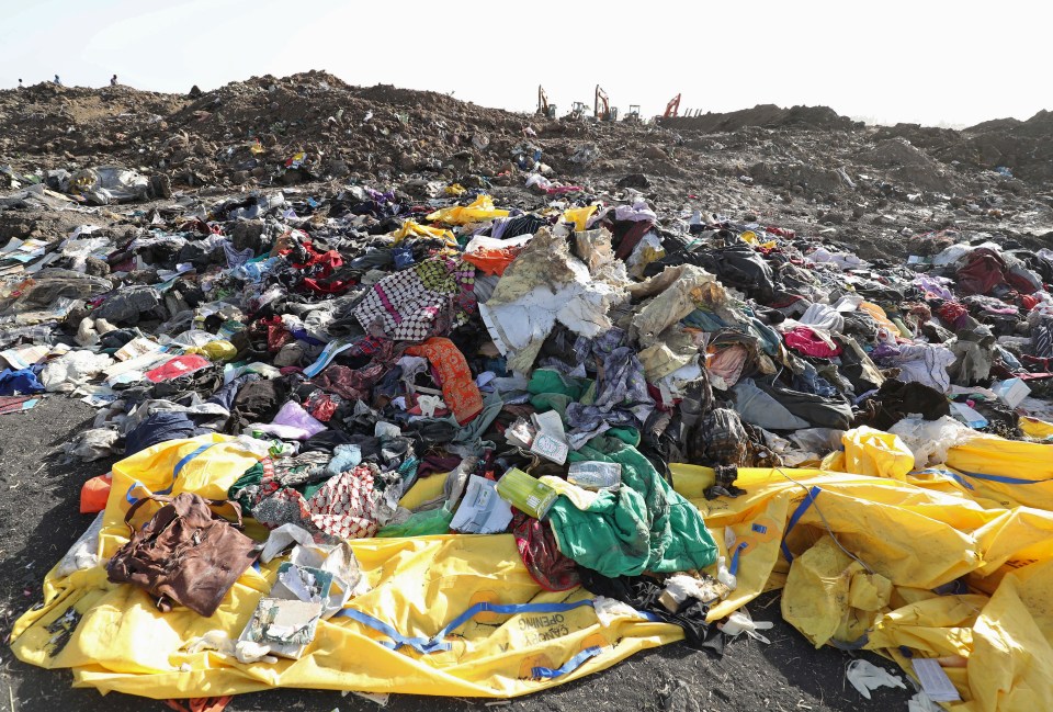 Passengers' clothing and personal effects gathered into a pile at the crash site today