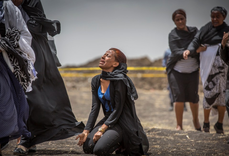 Ethiopian relatives of crash victims mourn and grieve at the scene where the Ethiopian Airlines Boeing 737 Max 8 crashed