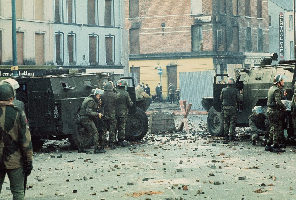  British soldiers behind armoured water cannon and armoured cars as tensions rise during a march in Derry