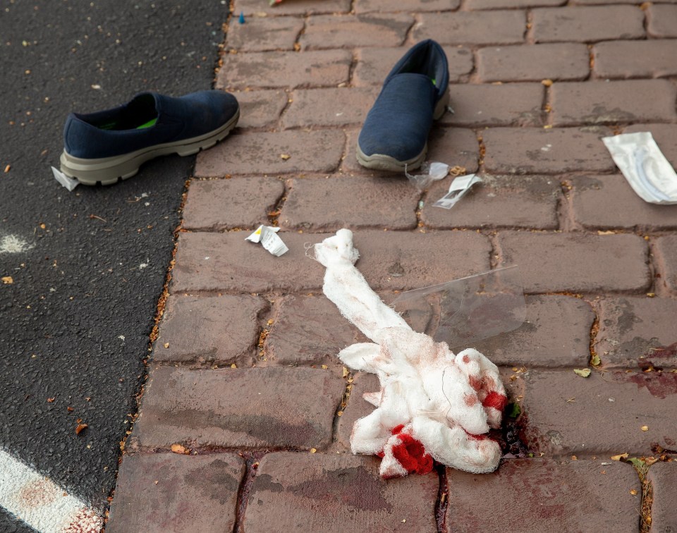 Bloodied bandages are seen on the ground outside the Masjid Al Noor mosque