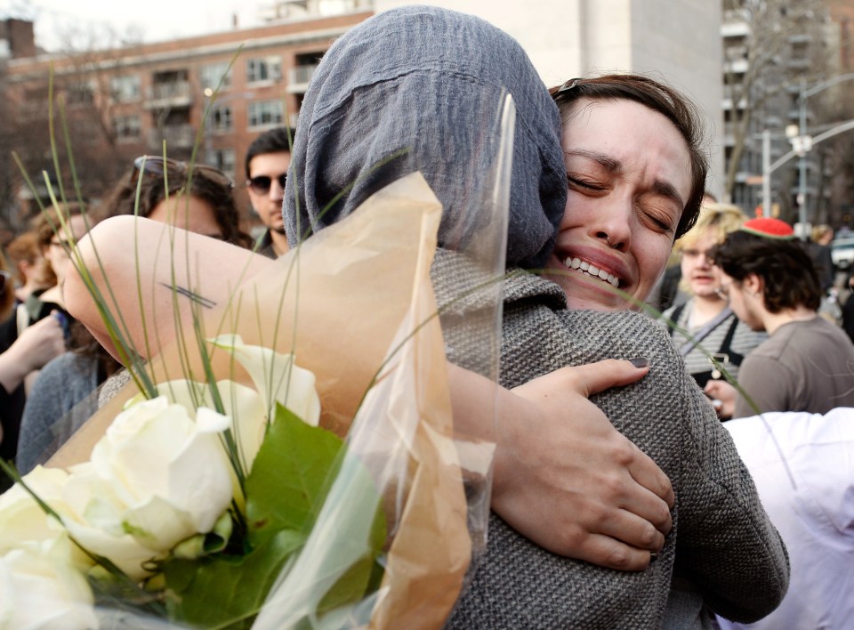 Well-wishers supported each other following the harrowing attacks