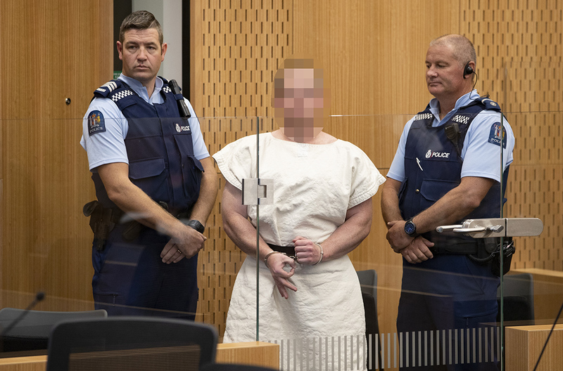 Brenton Harrison Tarrant, 28, made a white power symbol as he appeared in court charged with murder