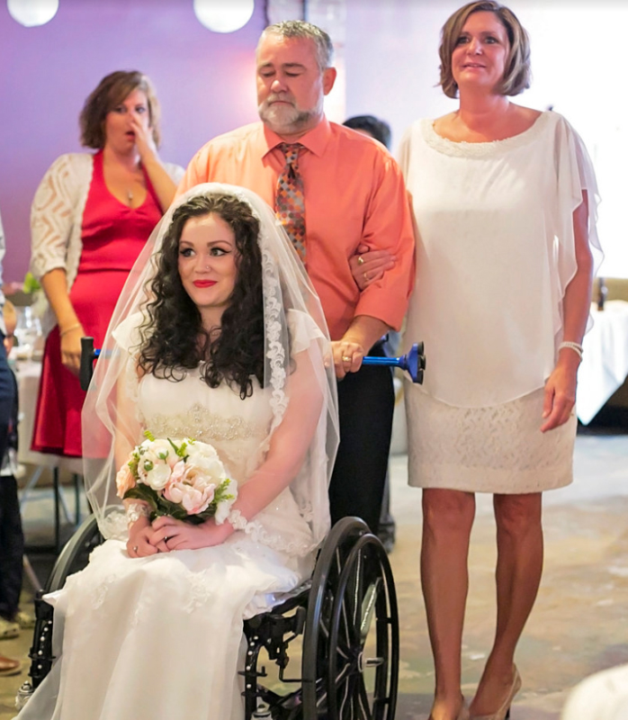  Her parents pushed her down the aisle on her wedding day