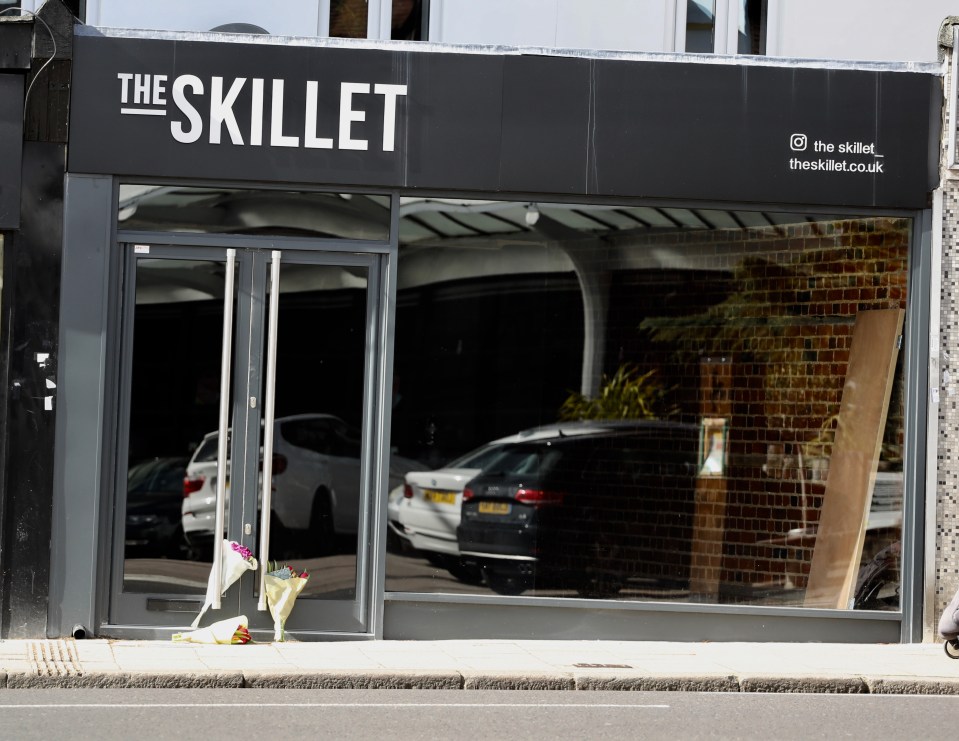  Flowers have been left outside the restaurant he was due to open