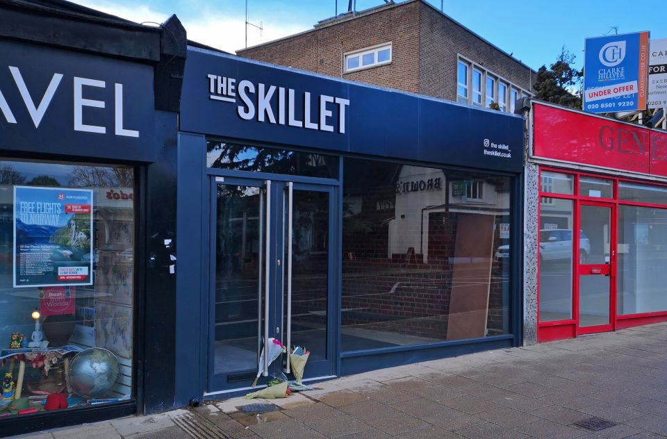  Flowers have been left outside the cafe Mike was about to open