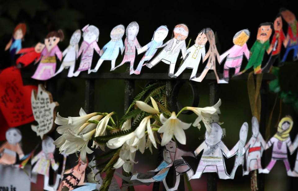 Tributes are seen hanging on the wall of the Botanic Gardens on March 18, 2019 in Christchurch