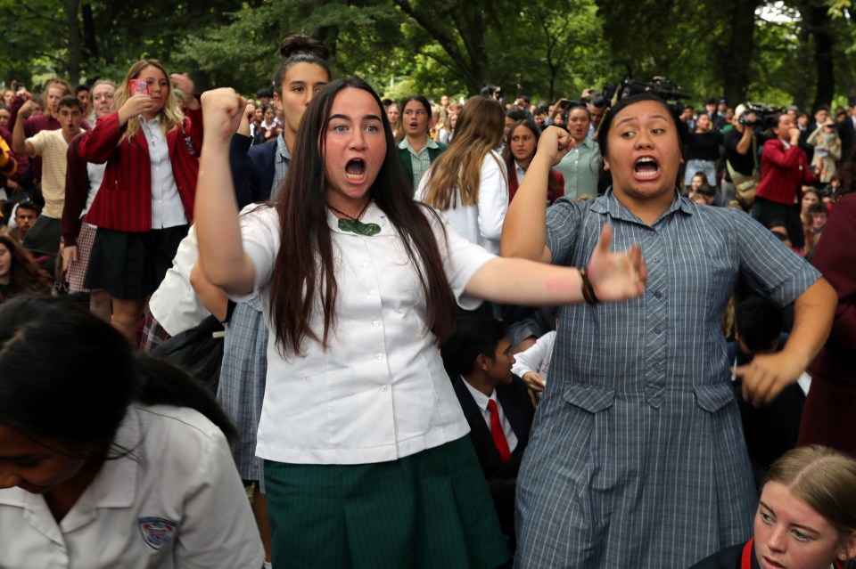 Students perform the Haka as they gather in a vigil to commemorate victims of Friday’s shooting