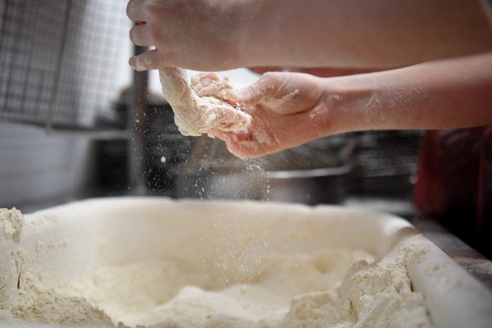 The famous spices are mixed into the flour which coats the raw chicken and becomes the crispy batter