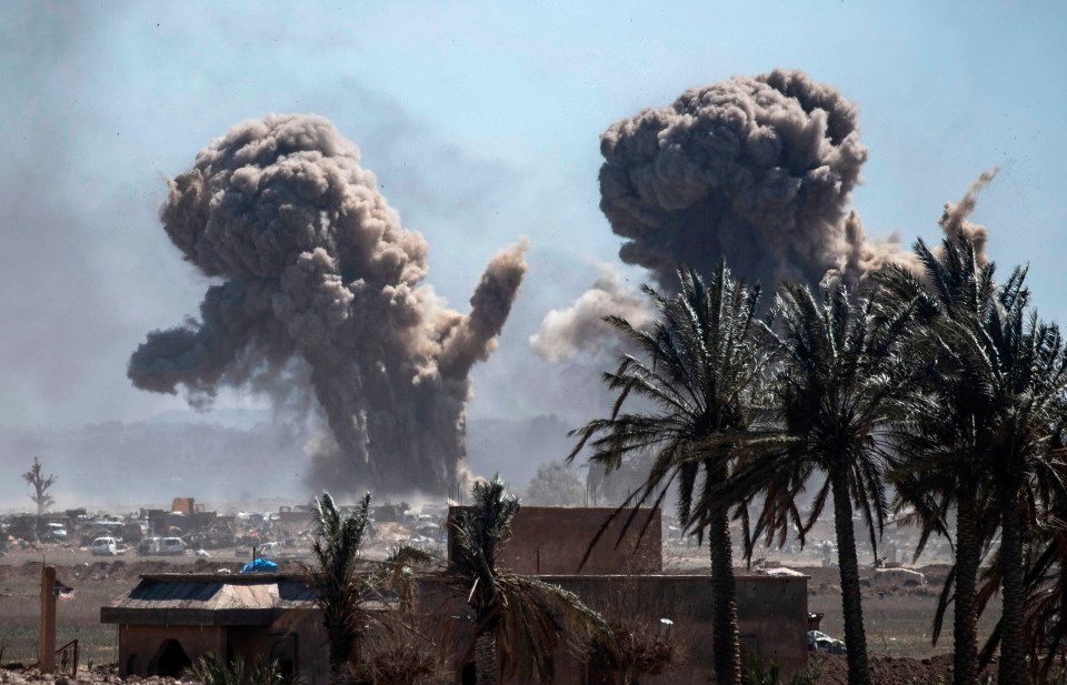 Smoke rises over the village of Baghouz, where the ISIS killers are holed up