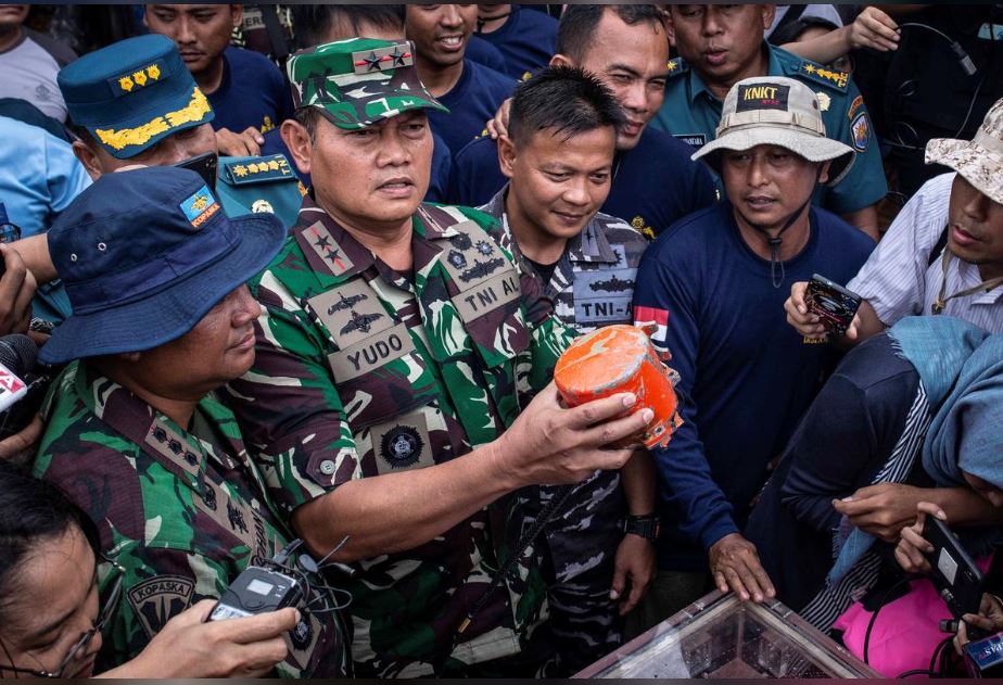  Indonesia's Navy Commander Rear Admiral Yudo Margono holds the cockpit voice recorder