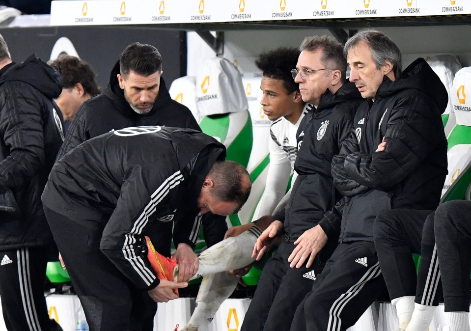  Sane, 23, received treatment on his ankle after hobbling off the pitch in injury time