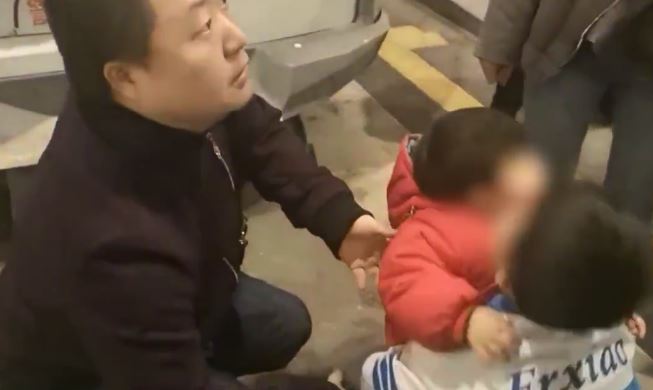  The girl, in red, was reunited with her family by police in China