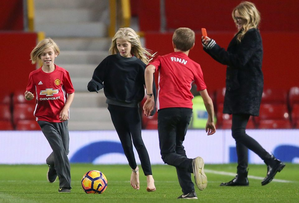  Julia is mum to 14-year-old twins Hazel and Finn, and son Henry, 11 - who all support Manchester United