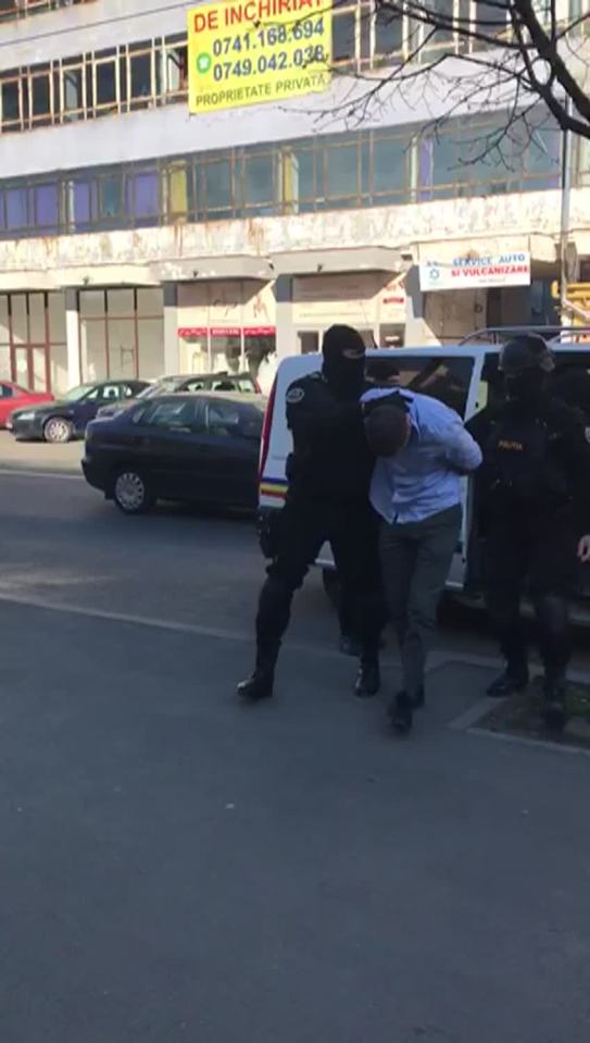  O'Brien is seen being escorted away by two officers