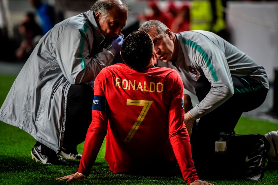  Ronaldo receives treatment from Portugal medics on the sidelines