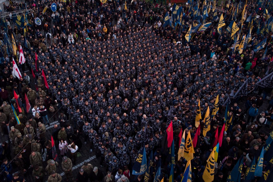 Members of nationalist movements stand in formation during a rally marking Defender of Ukraine Day in Kiev