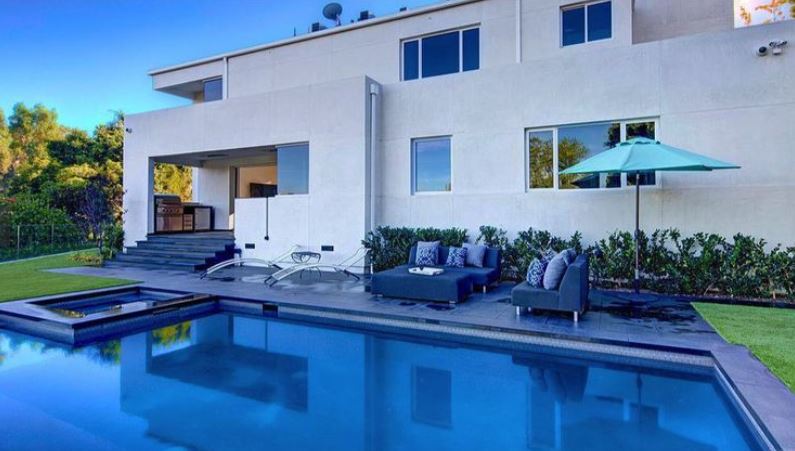 The stunning home has a pool and a jacuzzi 