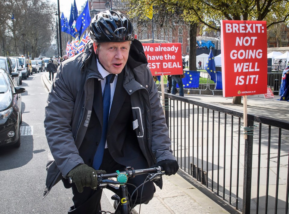  Boris Johnson pictured cycling in to Parliament today