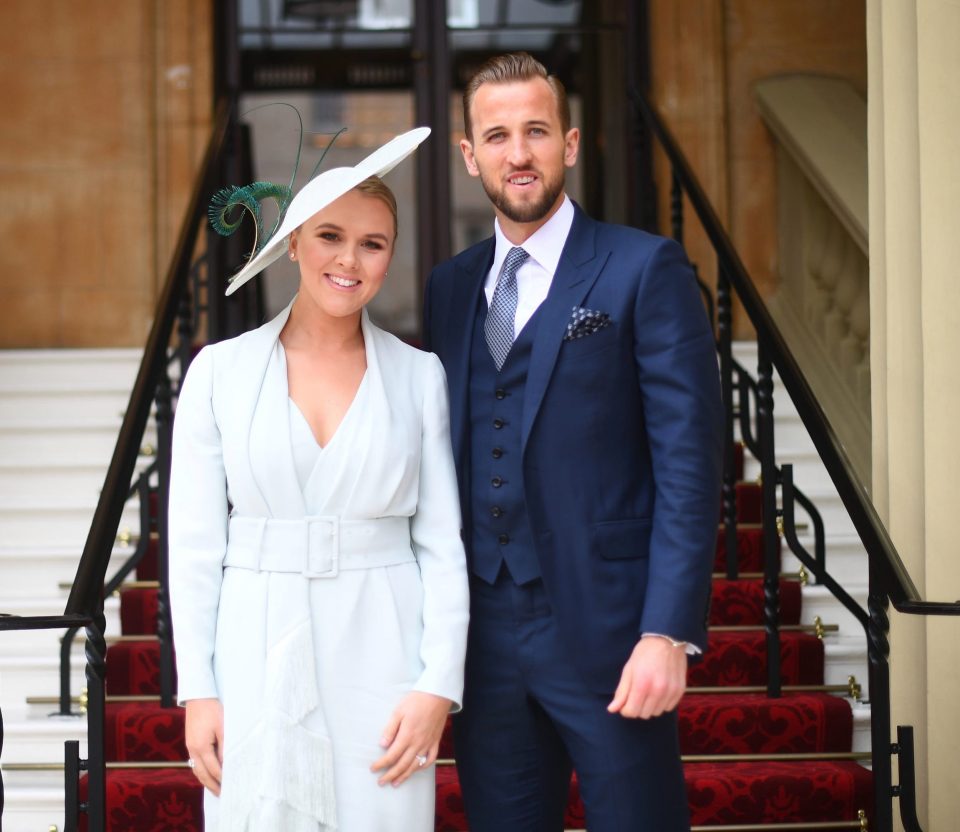  Kane was joined at Buckingham Palace by his partner Kate Goodland