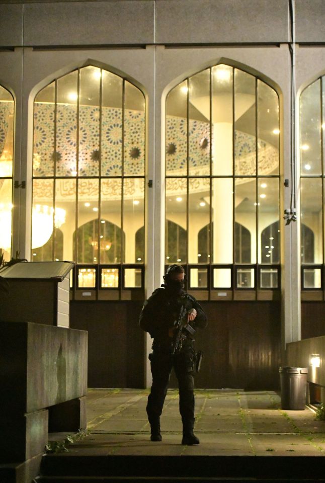  An armed officer standing outside the mosque which was sealed off