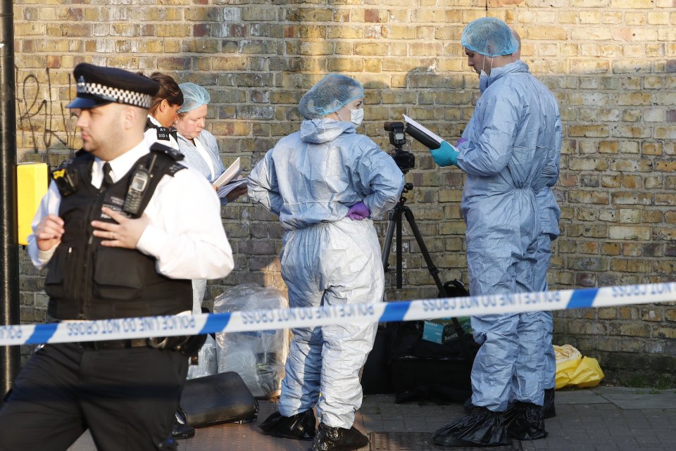  Forensic investigators at the scene of the crime