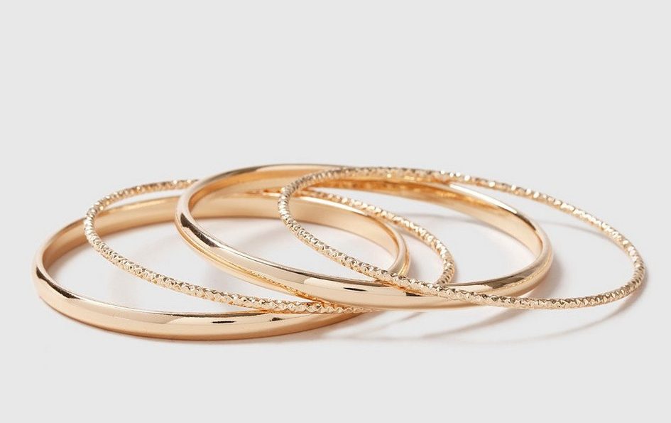  A gold pack of four bangles - two plain and two with a diamond cut - is now available at Dorothy Perkins for under £10