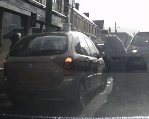  The man bellows at another parent in Port Talbot, Wales