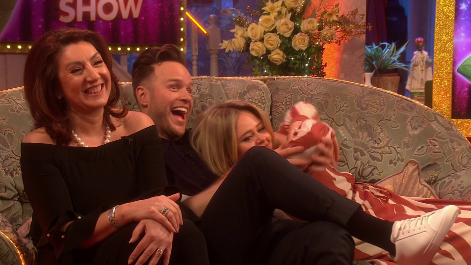  Olly and Emily snuggled up on the sofa beside Jane McDonald