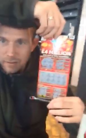  Holding up the scratchcard the crook bragged about their £4m win