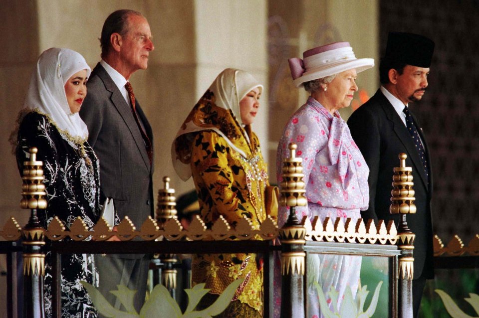  The Queen and Prince Philip with the Sultan and Queen Seleha on a visit to the £1 billion palace in 1998