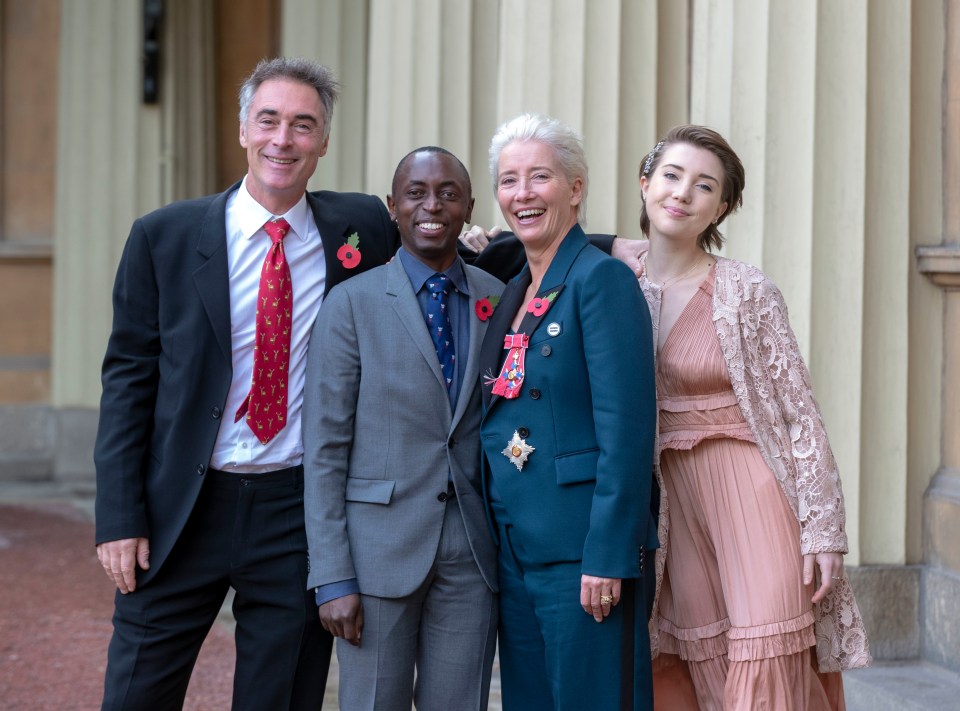 Emma Thompson stands outside Buckingham Palace, London, with her husband Greg Wise and children Gaia Wise and Tindy Agaba, after being made a Dame Commander of the British Empire by Prince William